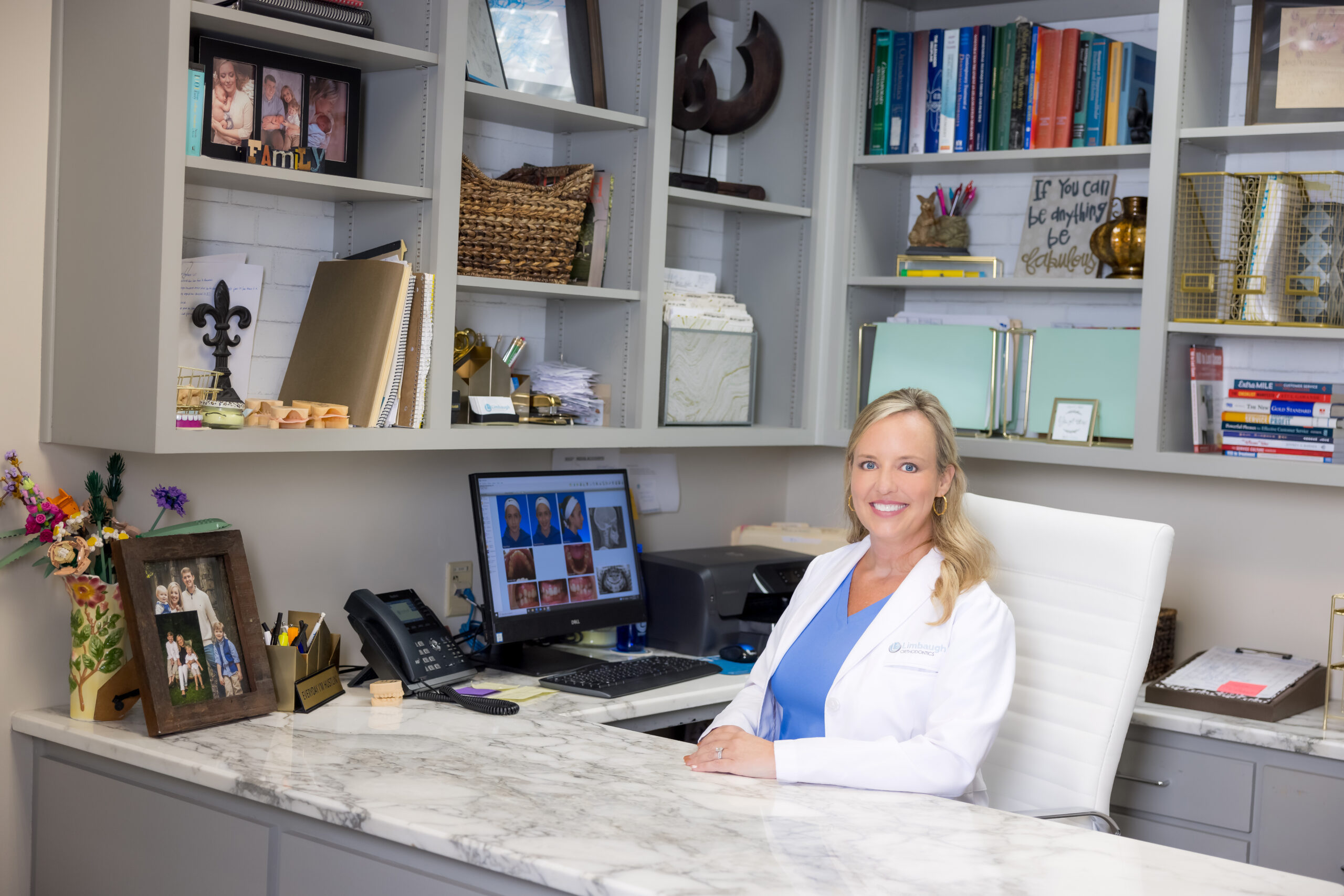 Dr. Lindsay Limbaugh working at her desk in the Huntsville office