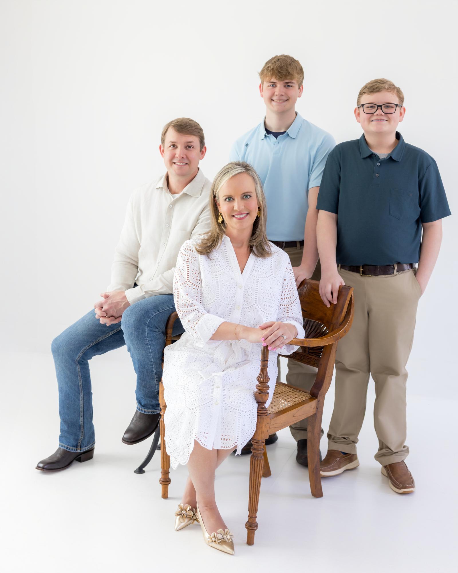 Dr. Lindsay Limbaugh seated with her husband and sons behind her