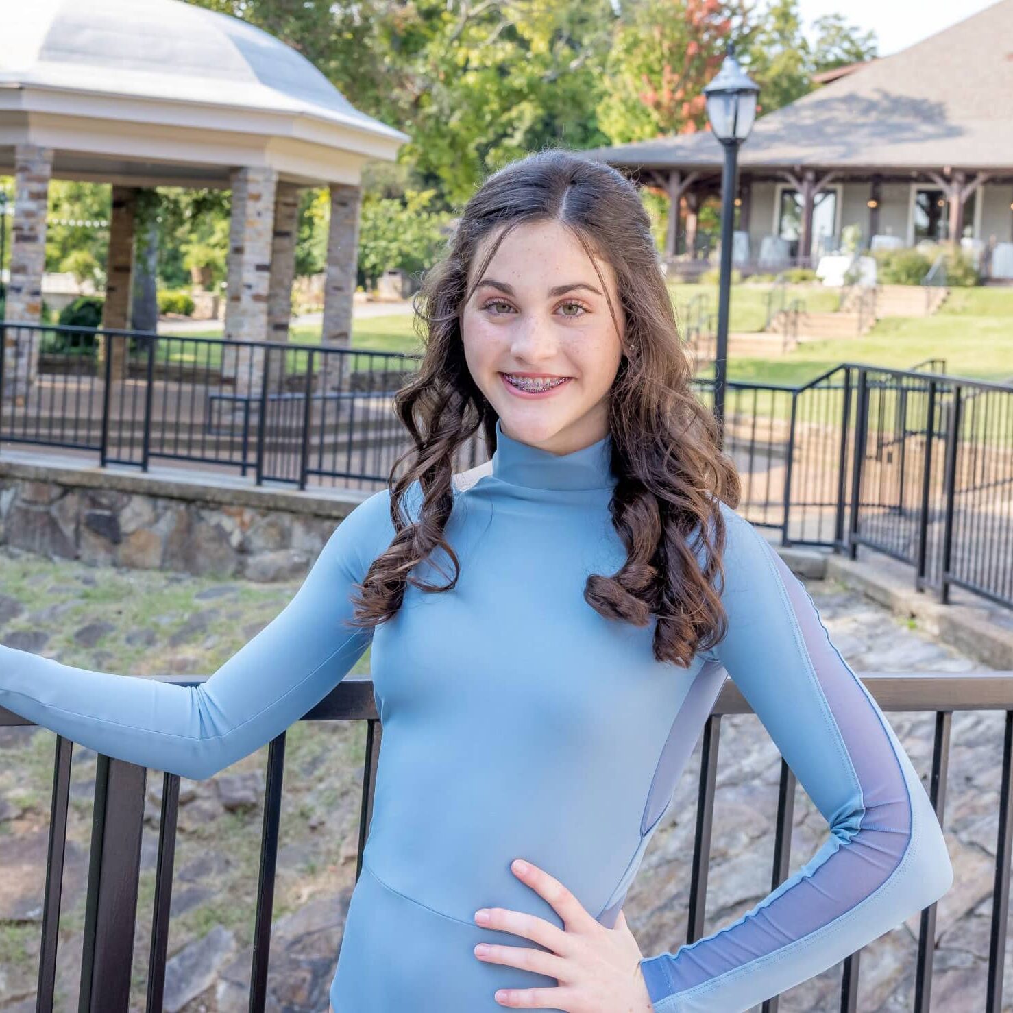 Limbaugh Orthodontics patient standing beside a park gazebo
